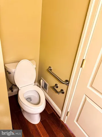 a kitchen with stainless steel appliances granite countertop a sink stove and wooden floor