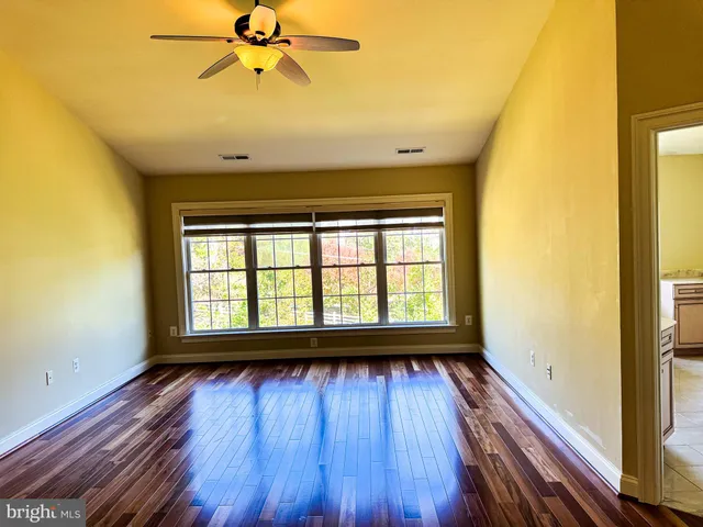 a bathroom with a shower a toilet and a sink