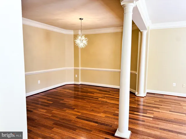 a view of entryway with wooden floor and stairs