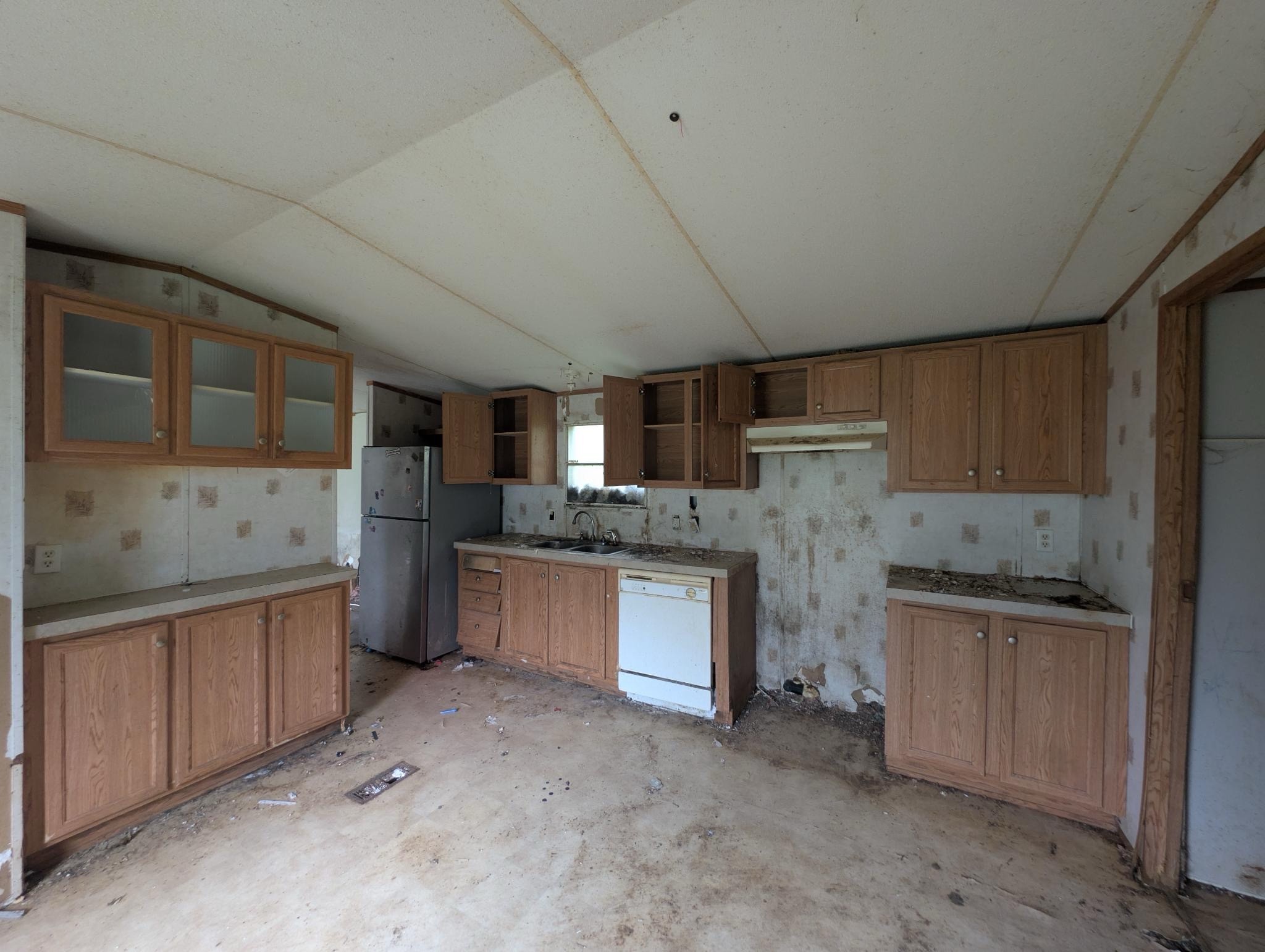 1023 Abiff Road Bon Aqua, TN 37025 - Photo 11 of 14 a kitchen with a sink stove and cabinets