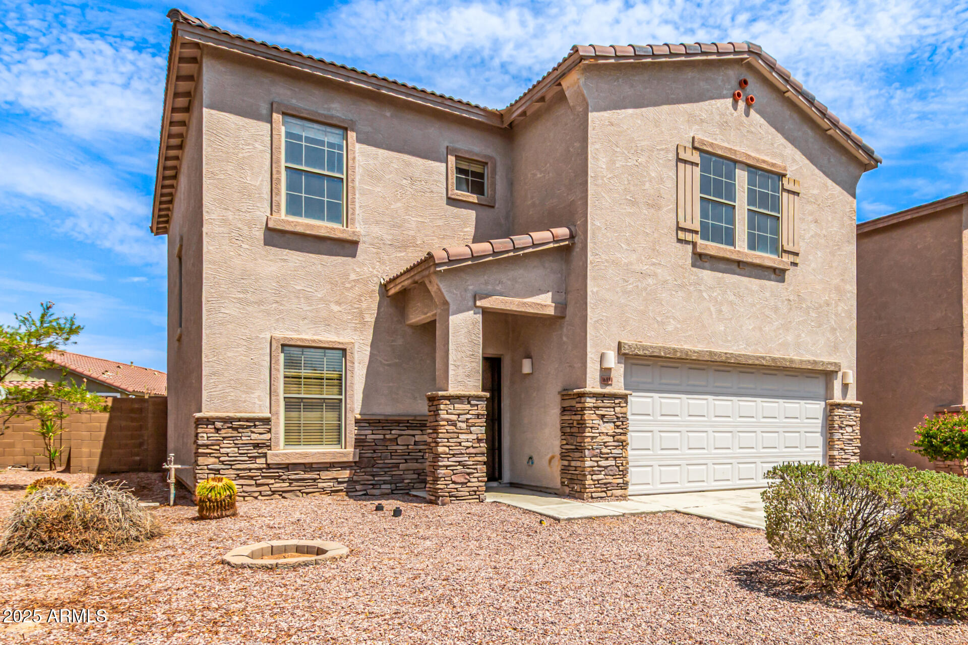 16890 West Rimrock Street Surprise, AZ 85388 - Photo 1 of 28 a front view of a house with a yard