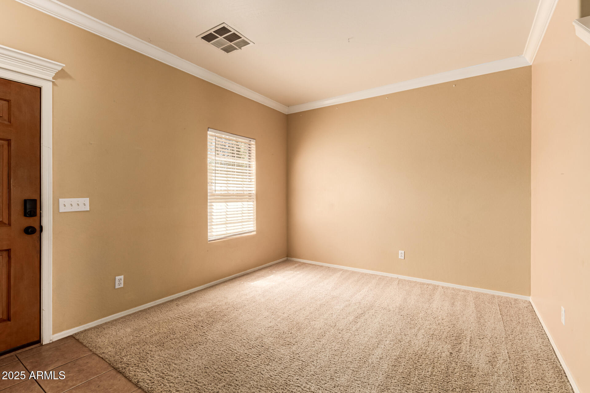 16890 West Rimrock Street Surprise, AZ 85388 - Photo 12 of 28 a view of an empty room with a window
