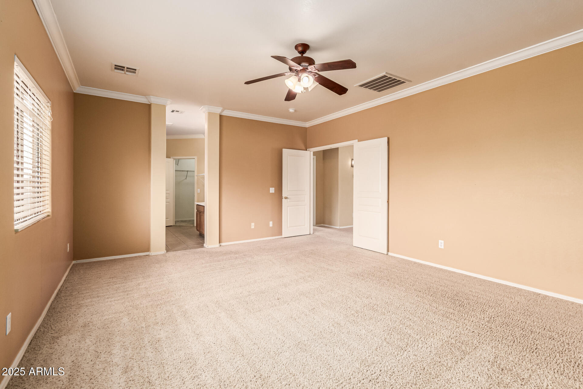 16890 West Rimrock Street Surprise, AZ 85388 - Photo 17 of 28 a view of a livingroom with a ceiling fan and window