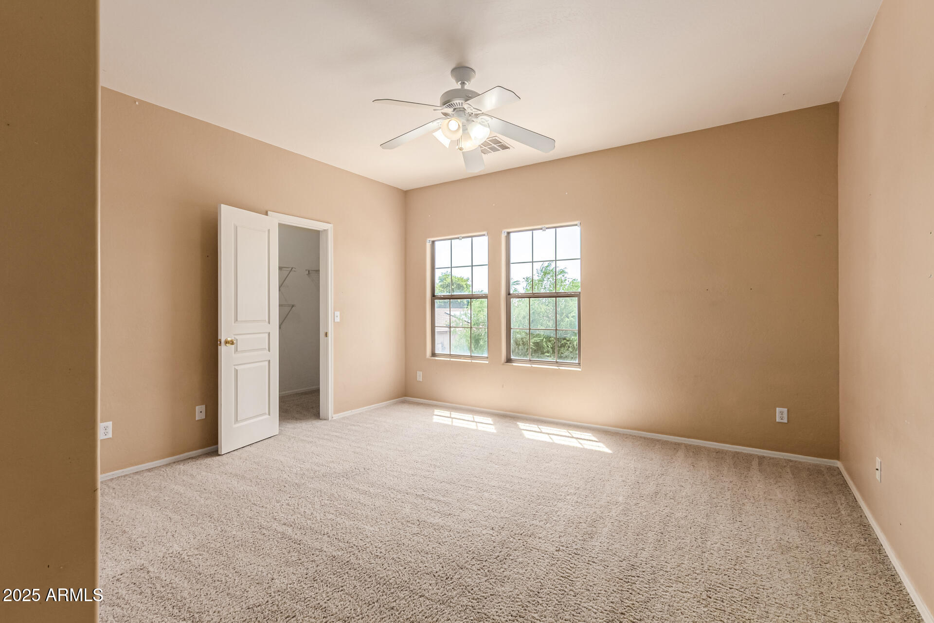 16890 West Rimrock Street Surprise, AZ 85388 - Photo 18 of 28 wooden floor in an empty room with a window