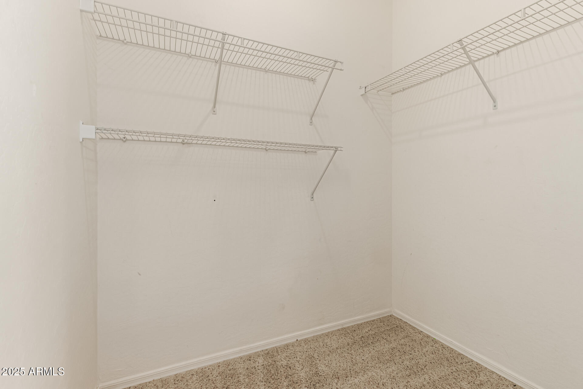 16890 West Rimrock Street Surprise, AZ 85388 - Photo 20 of 28 a view of a room with racks on the wall