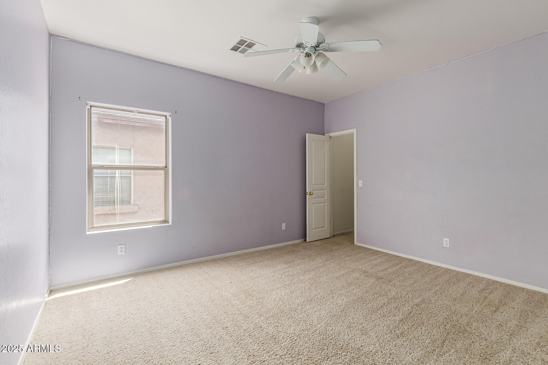 16890 West Rimrock Street Surprise, AZ 85388 - Photo 21 of 28 a view of an empty room with a window