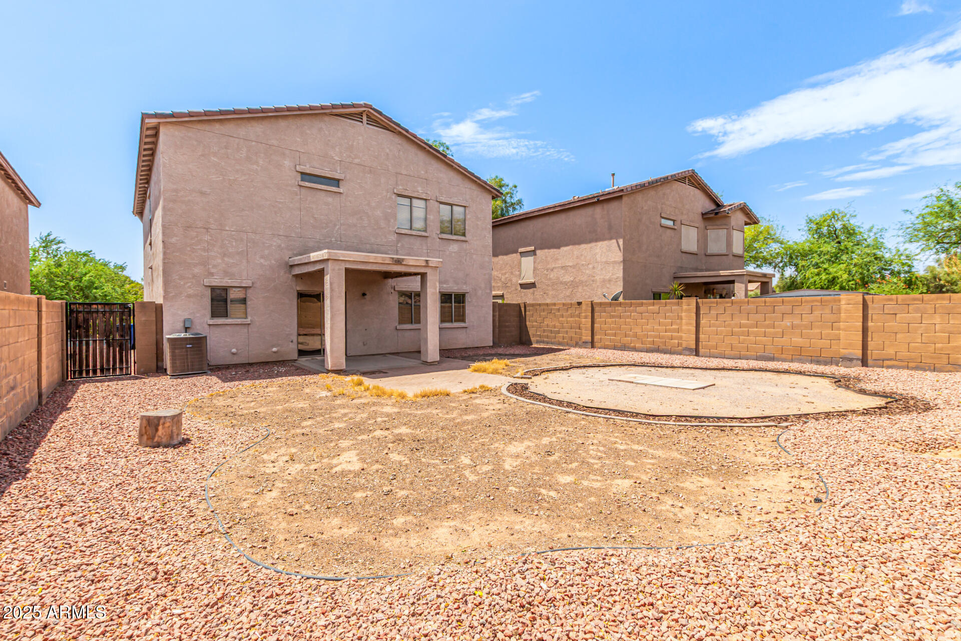 16890 West Rimrock Street Surprise, AZ 85388 - Photo 25 of 28 a view of a white house with a yard