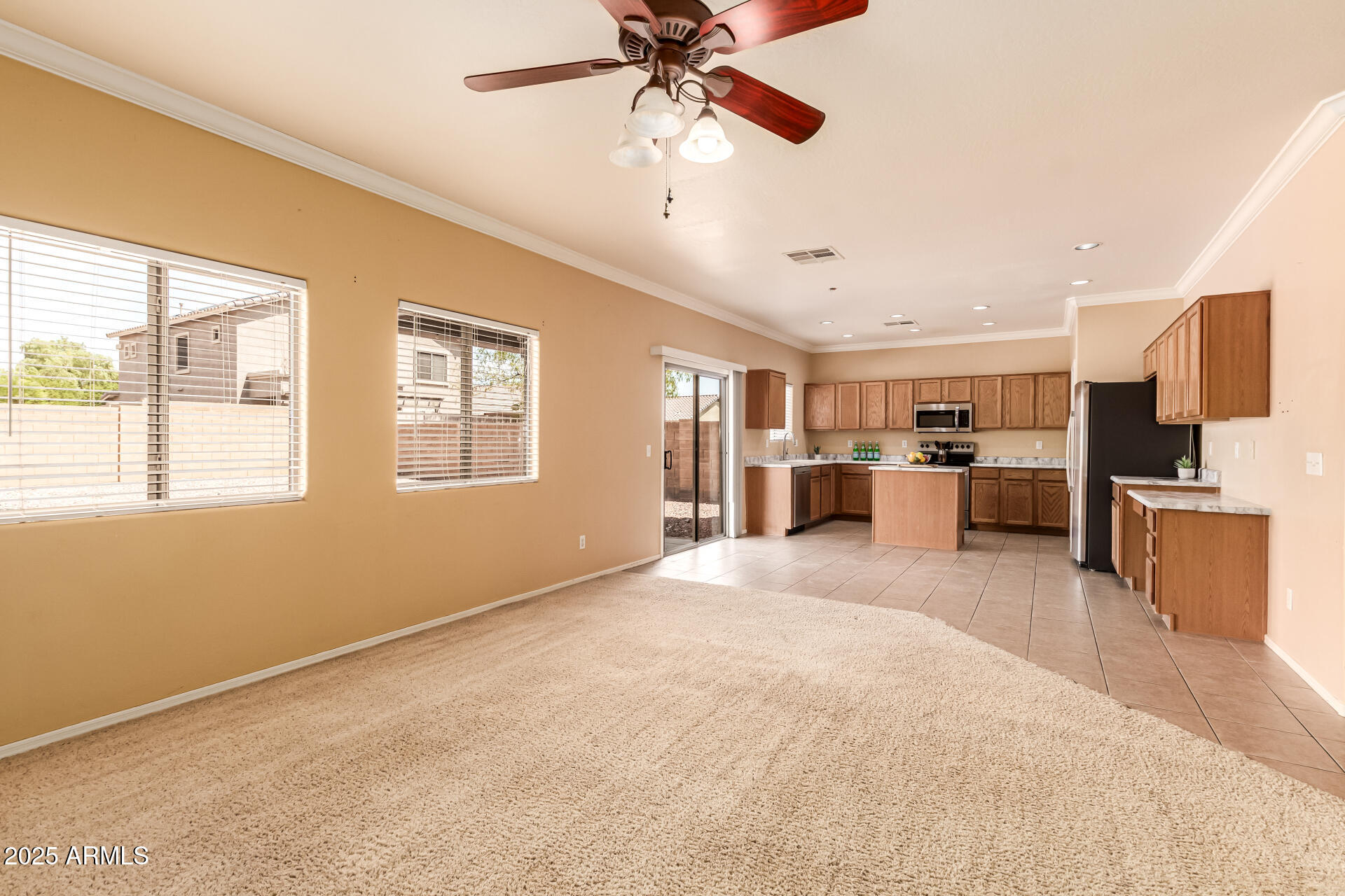 16890 West Rimrock Street Surprise, AZ 85388 - Photo 3 of 28 a view of a kitchen with furniture and a kitchen