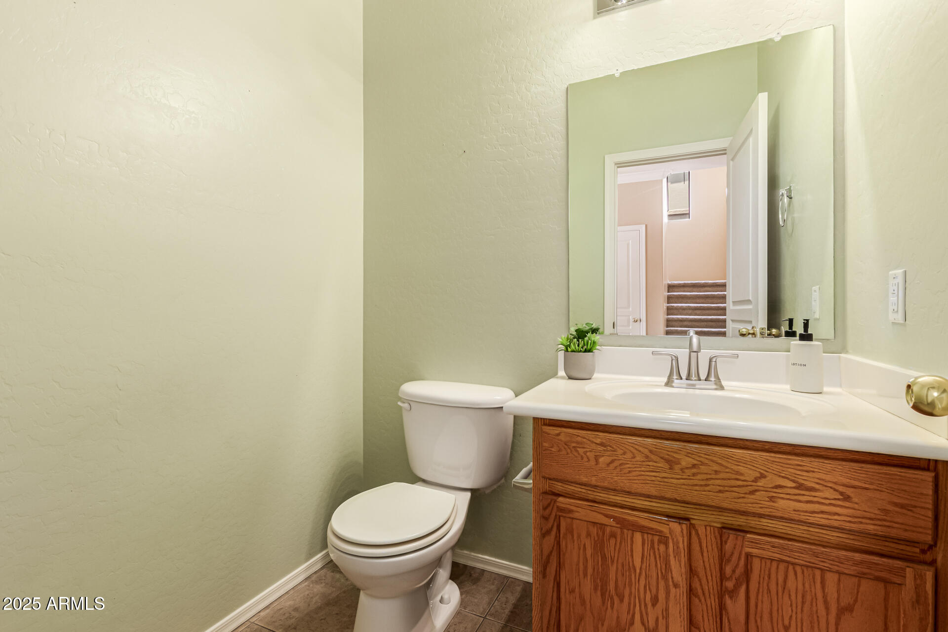 16890 West Rimrock Street Surprise, AZ 85388 - Photo 4 of 28 a bathroom with a sink and a toilet
