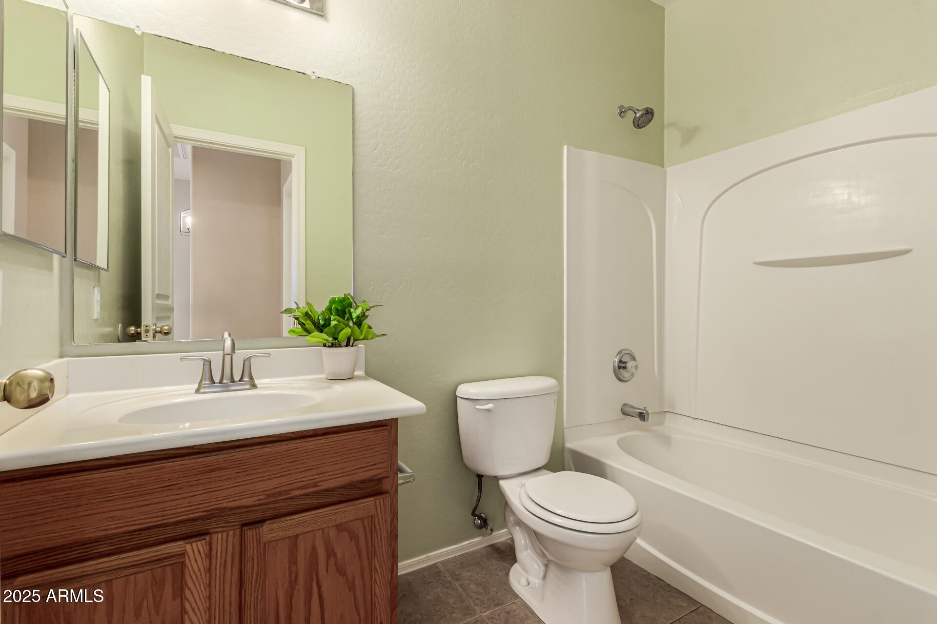 16890 West Rimrock Street Surprise, AZ 85388 - Photo 8 of 28 a bathroom with a sink a toilet and shower