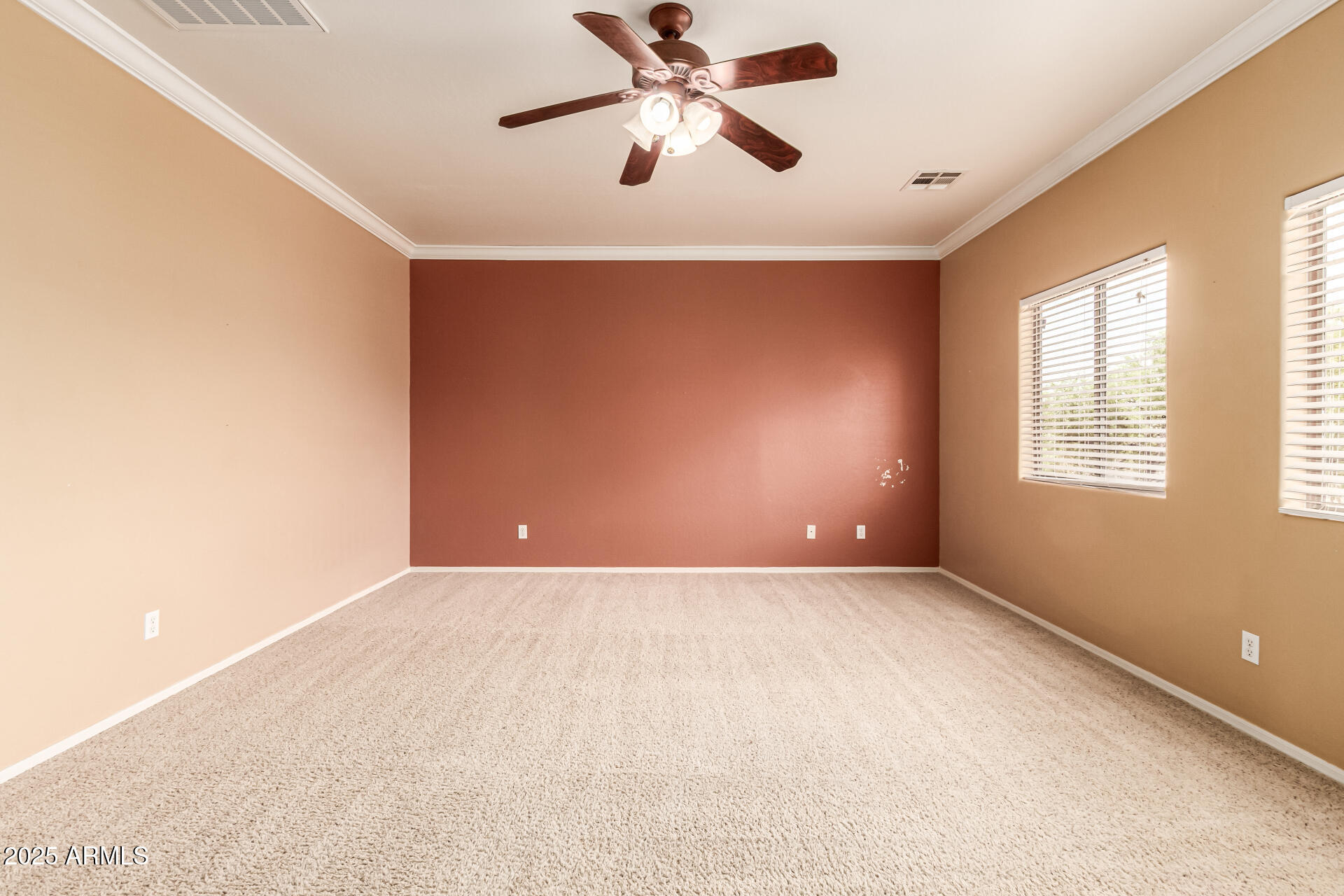 16890 West Rimrock Street Surprise, AZ 85388 - Photo 10 of 28 a view of a big room with windows and chandelier fan
