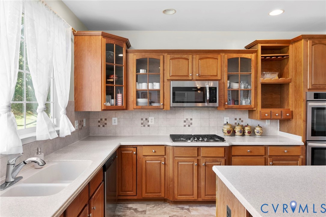 753 Blossom Tree Road Culpeper, VA 22701 - Photo 31 of 68 Kitchen featuring wood cabinetry with glass-front