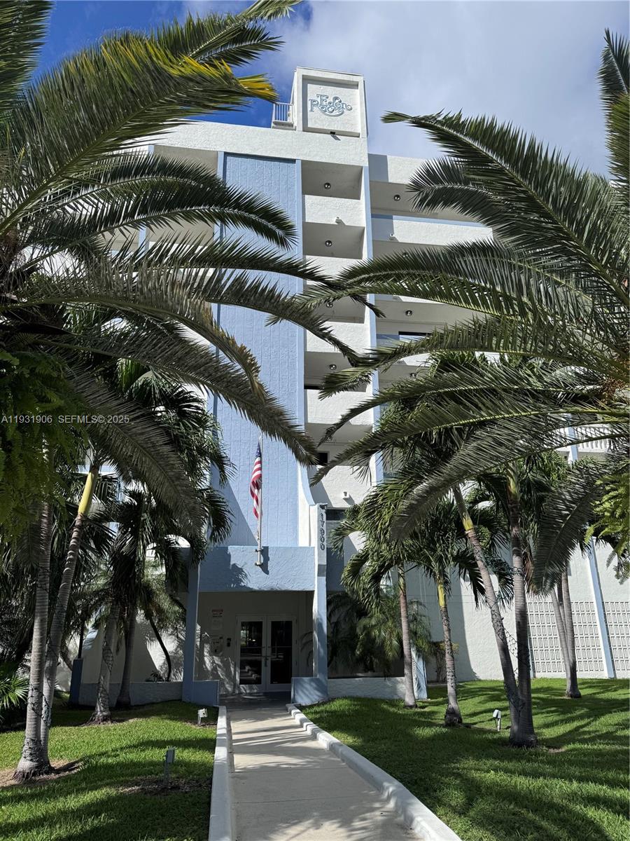 17900 North Bay Road, Unit 507 Sunny Isles Beach, FL 33160 - Photo 9 of 9 a view of a street with a building and trees in the background