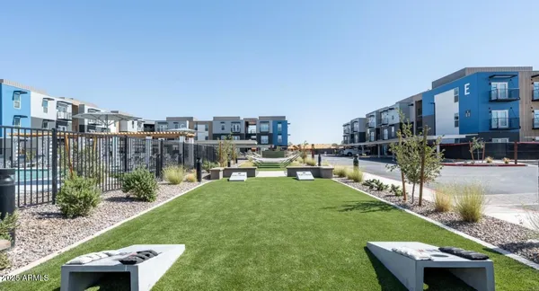 a view of a house with a yard from a patio