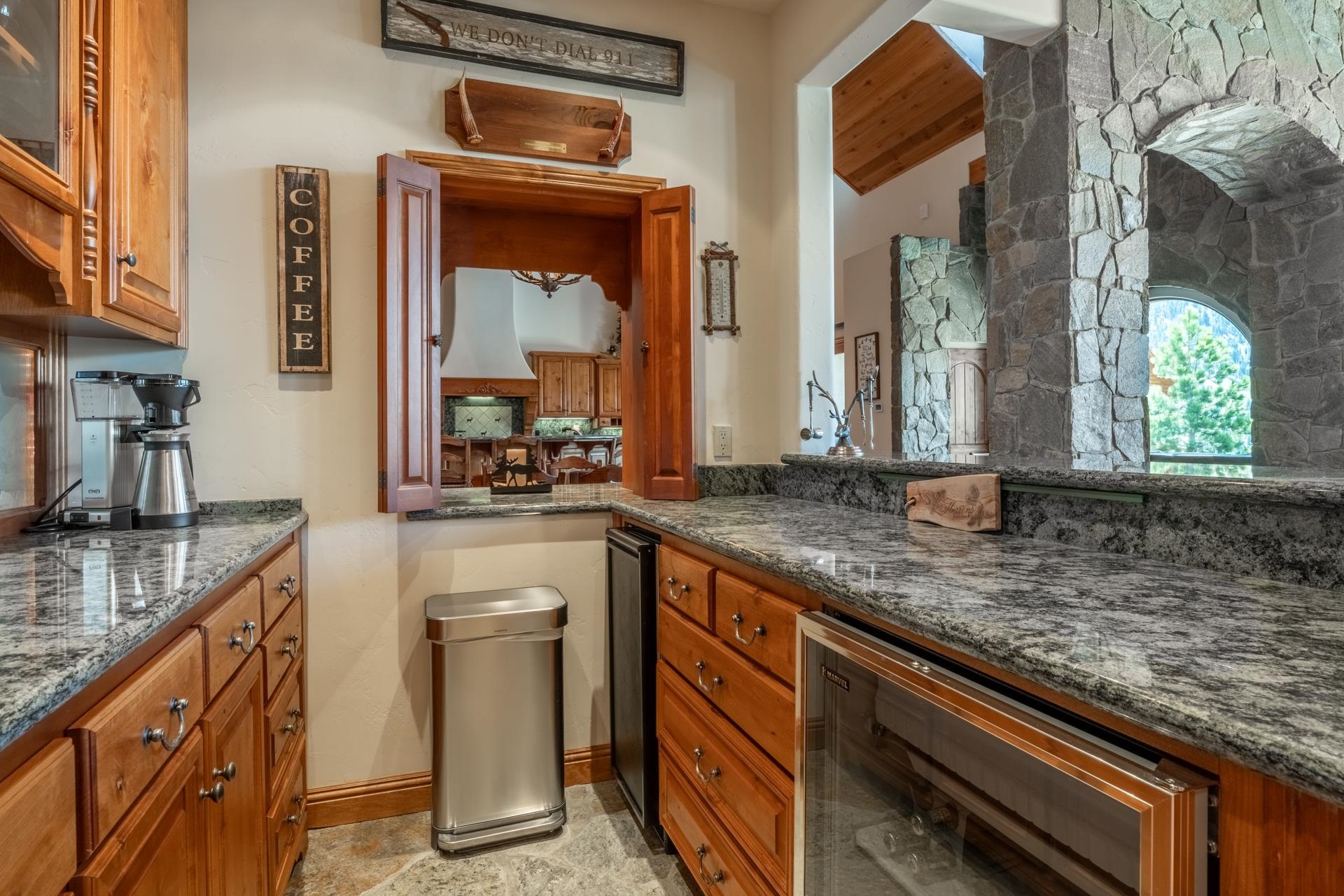 45 Skyline Road June Lake, CA 93529 - Photo 29 of 58 a kitchen with granite countertop a sink a stove and cabinets