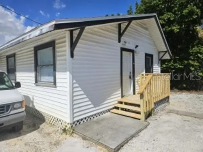 a view of a back yard of the house
