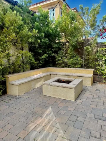 a plant that is in front of a brick building