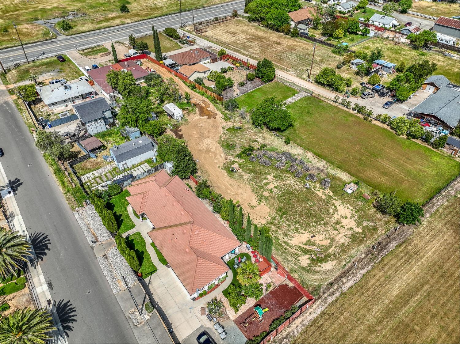 8758 Florin Road Sacramento, CA 95829 - Photo 4 of 14 an aerial view of residential houses with outdoor space