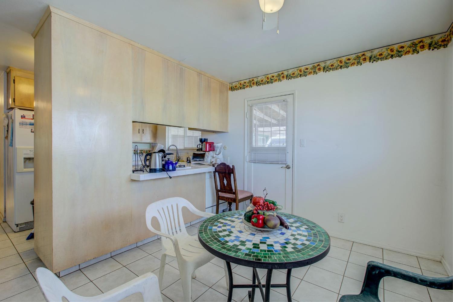 8758 Florin Road Sacramento, CA 95829 - Photo 10 of 14 a living room with furniture and a potted plant