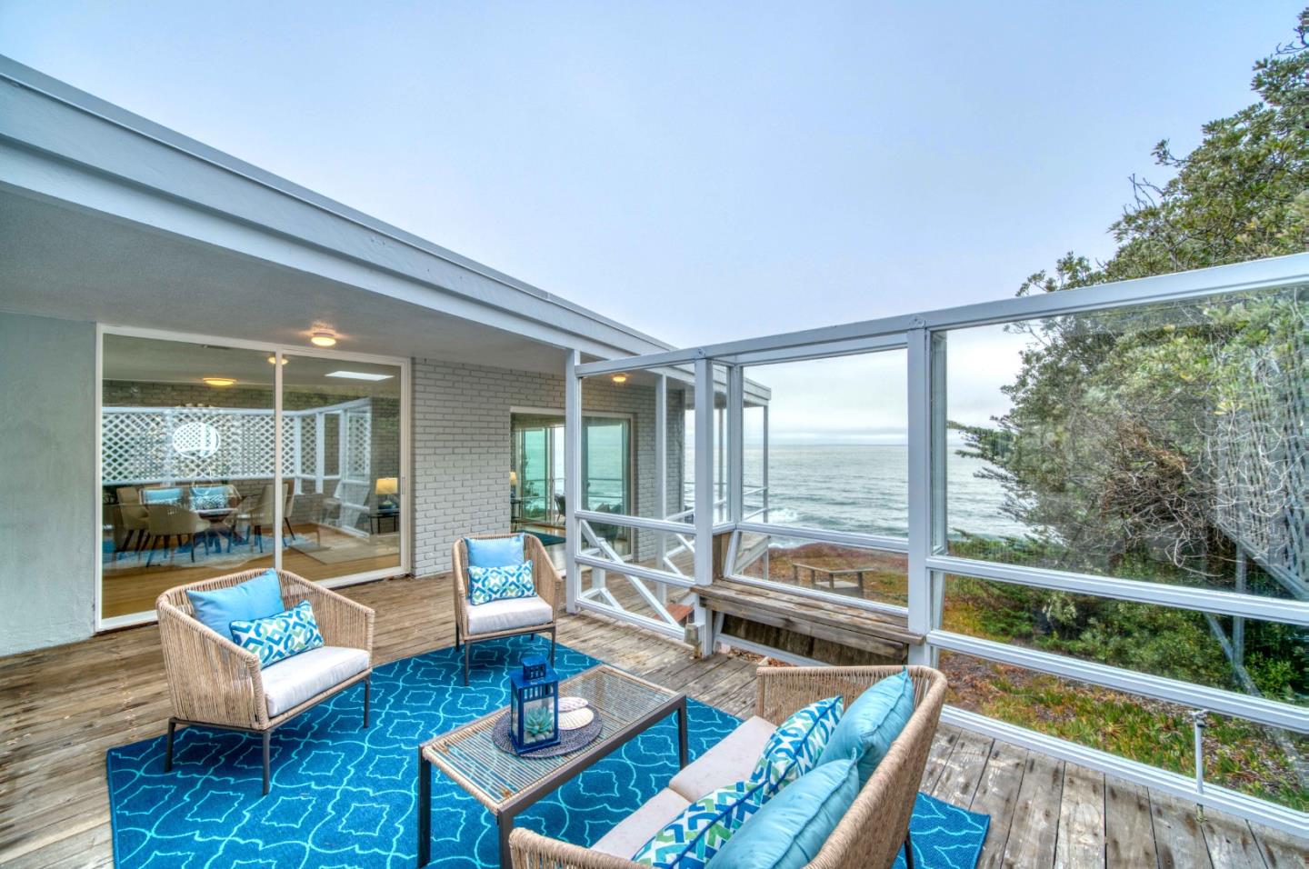 8701 Cabrillo Highway Montara, CA 94037 - Photo 12 of 40 a living room with furniture and a large window