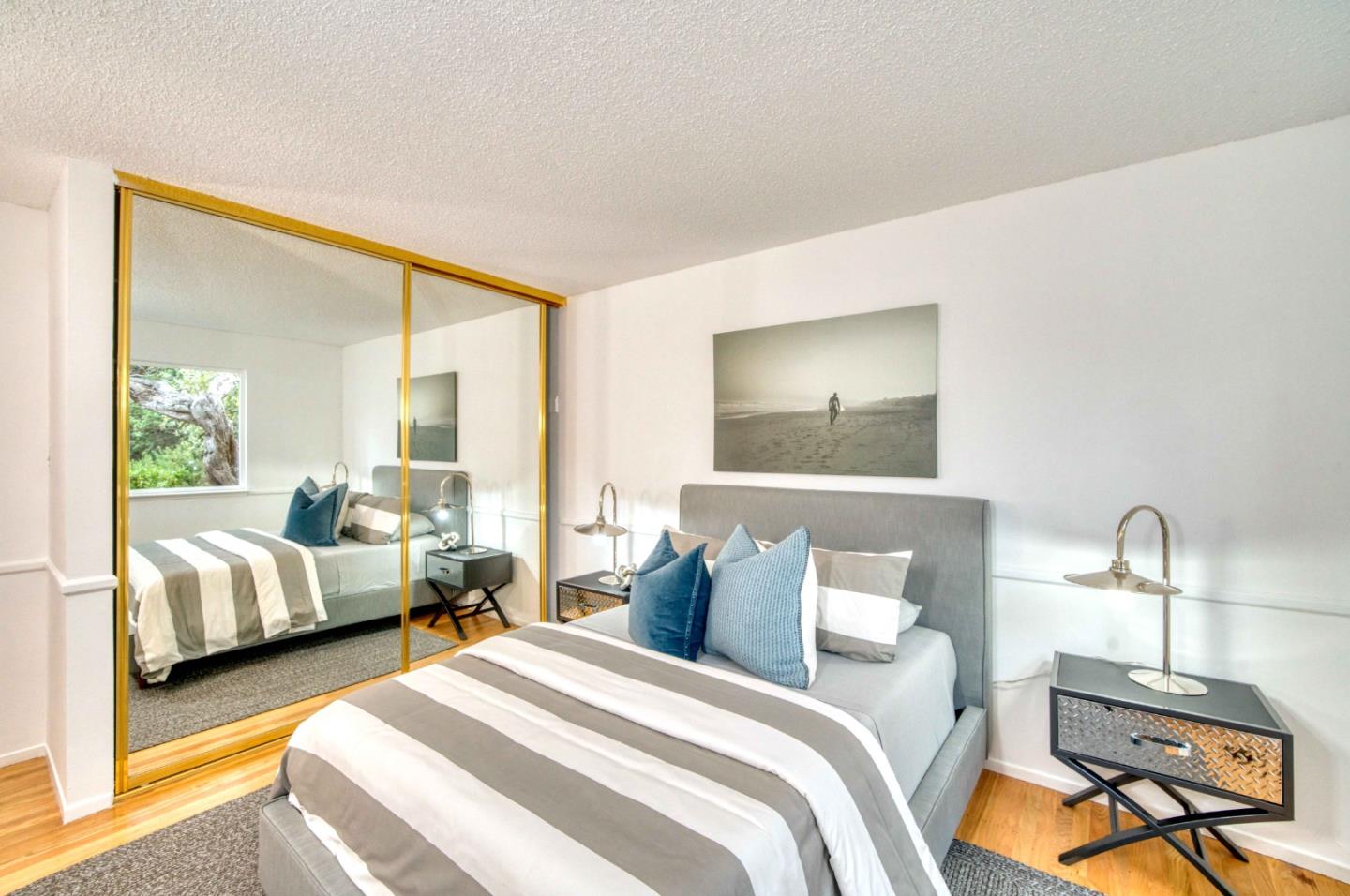 8701 Cabrillo Highway Montara, CA 94037 - Photo 22 of 40 a bedroom with bed and window