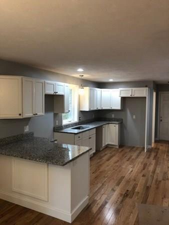Lot B Cutler Road Jefferson, MA 01522 - Photo 3 of 16 a kitchen with stainless steel appliances granite countertop a stove a sink and a white refrigerator