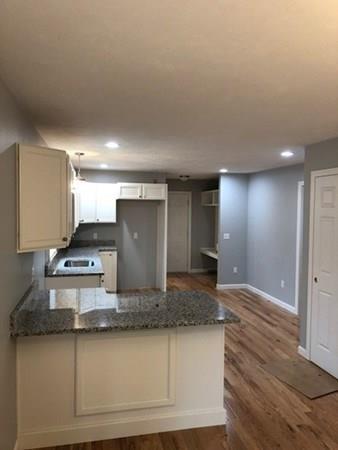 Lot B Cutler Road Jefferson, MA 01522 - Photo 4 of 16 a kitchen with kitchen island granite countertop a sink and a stove