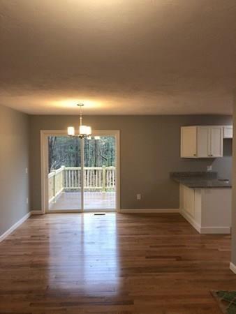 Lot B Cutler Road Jefferson, MA 01522 - Photo 5 of 16 a view of an empty room with wooden floor and a window