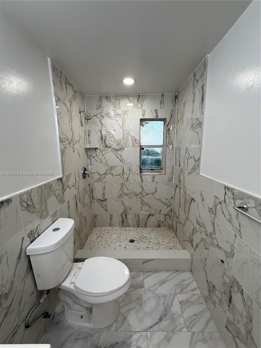 1600 West 14th Street Riviera Beach, FL 33404 - Photo 17 of 22 a bathroom with a toilet sink and shower