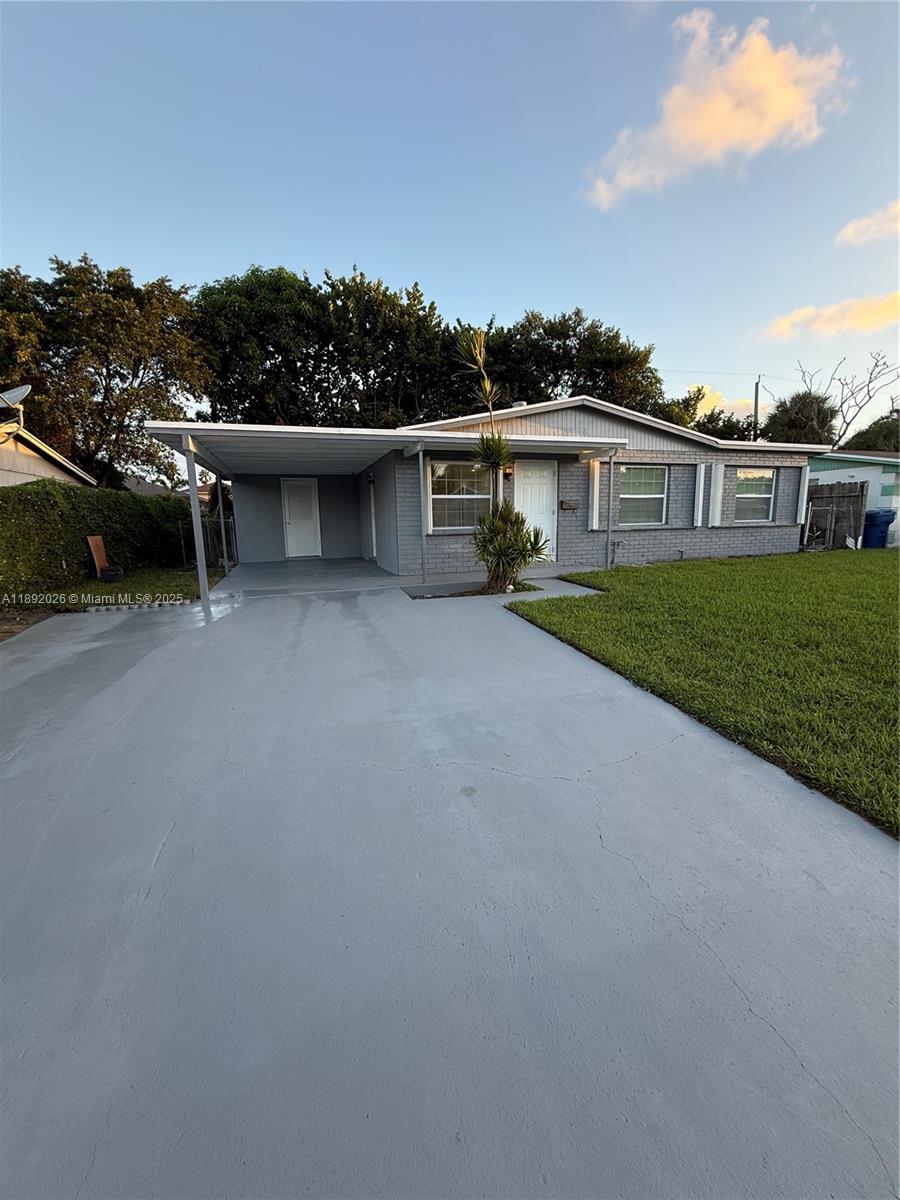 1600 West 14th Street Riviera Beach, FL 33404 - Photo 2 of 22 a view of a house with a garden