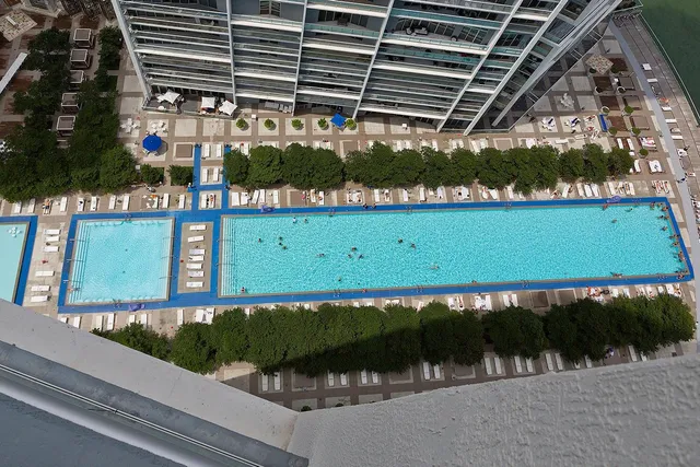 a view of swimming pool from a balcony