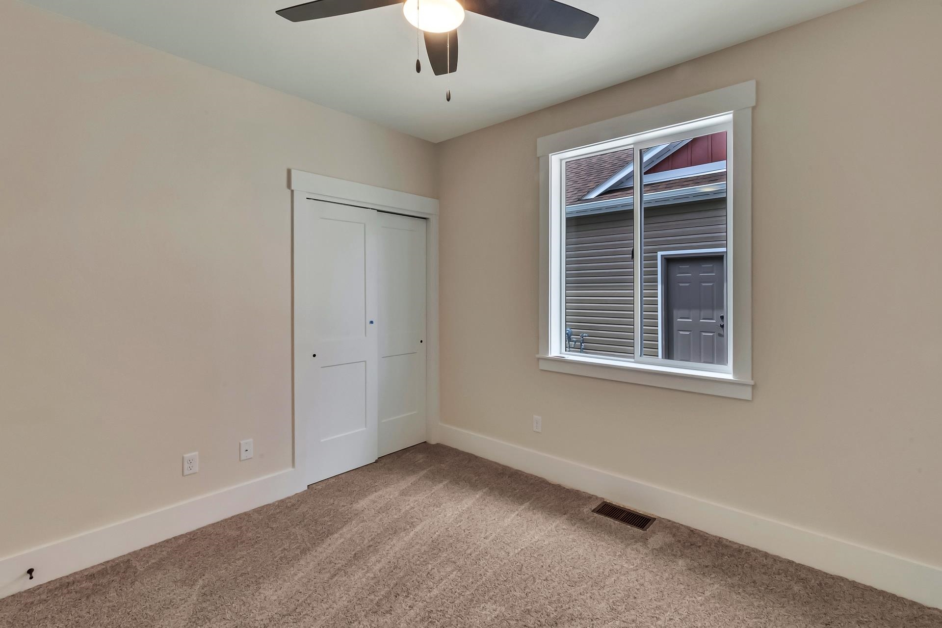1024 Snowdrop Court Fruita, CO 81521 - Photo 13 of 23 an empty room with a empty space and a ceiling fan