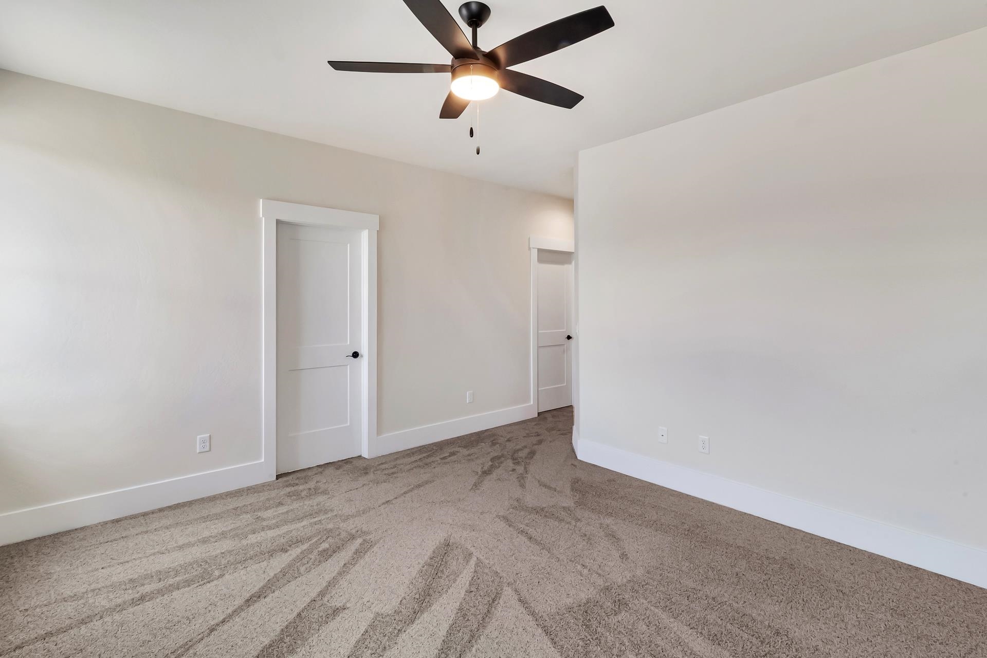1024 Snowdrop Court Fruita, CO 81521 - Photo 15 of 23 an empty room with closet and a ceiling fan