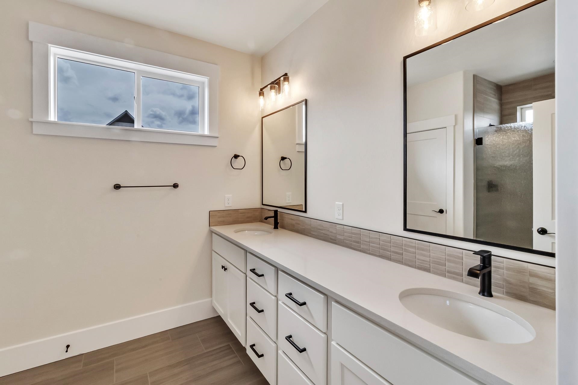 1024 Snowdrop Court Fruita, CO 81521 - Photo 16 of 23 a bathroom with double vanity sink and a mirror