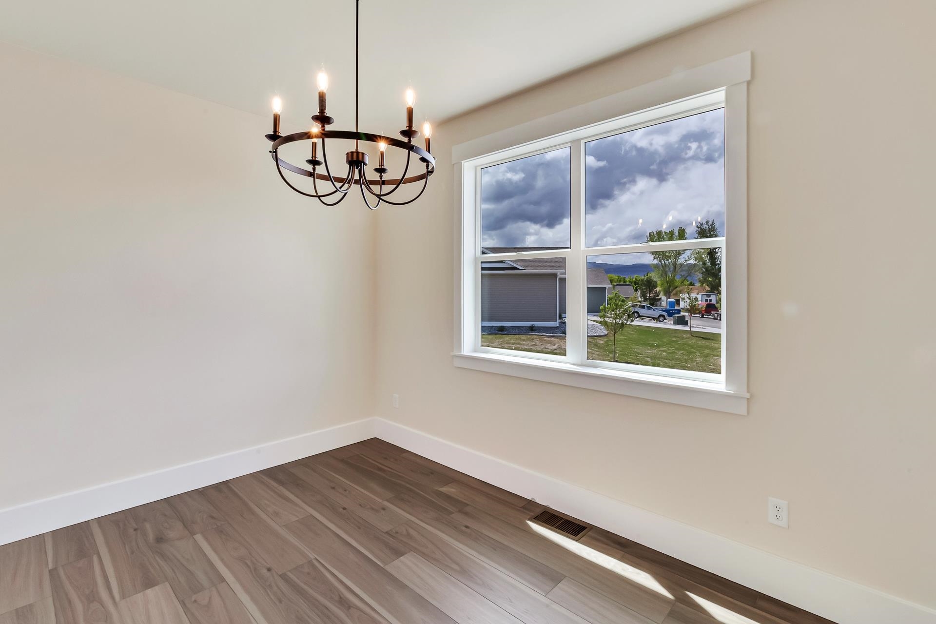 1024 Snowdrop Court Fruita, CO 81521 - Photo 8 of 23 a view of a room with a window and wooden floor