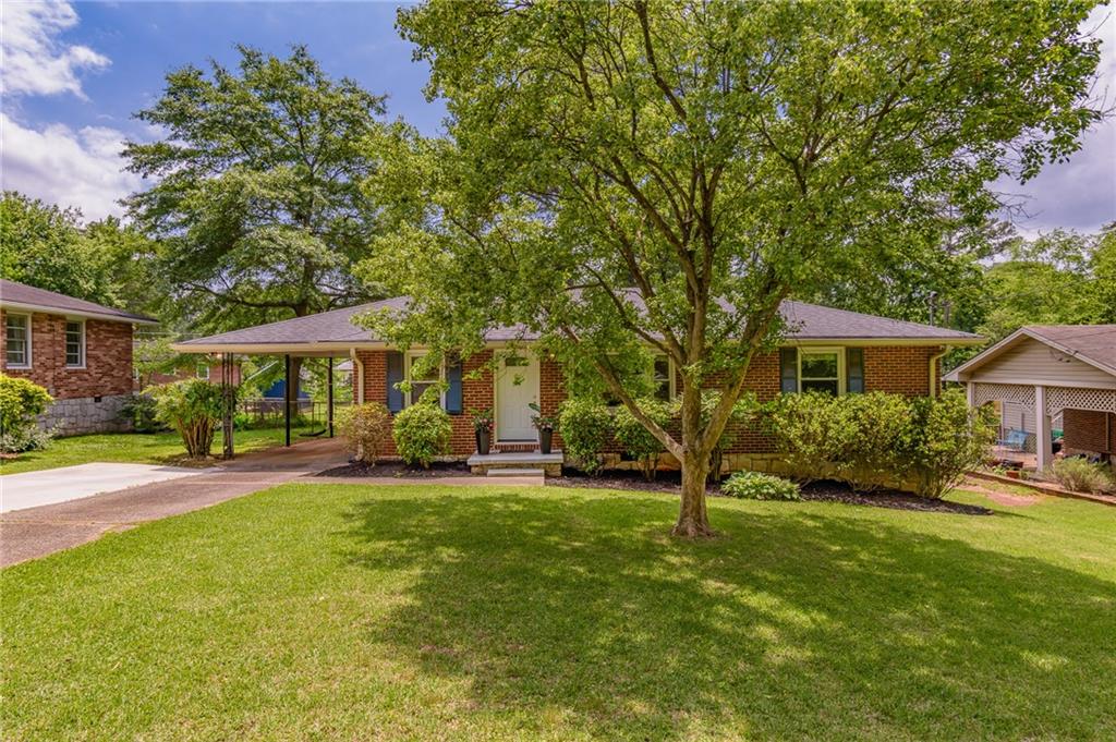 2627 Fox Hills Drive Decatur, GA 30033 - Photo 1 of 1 a front view of a house with garden