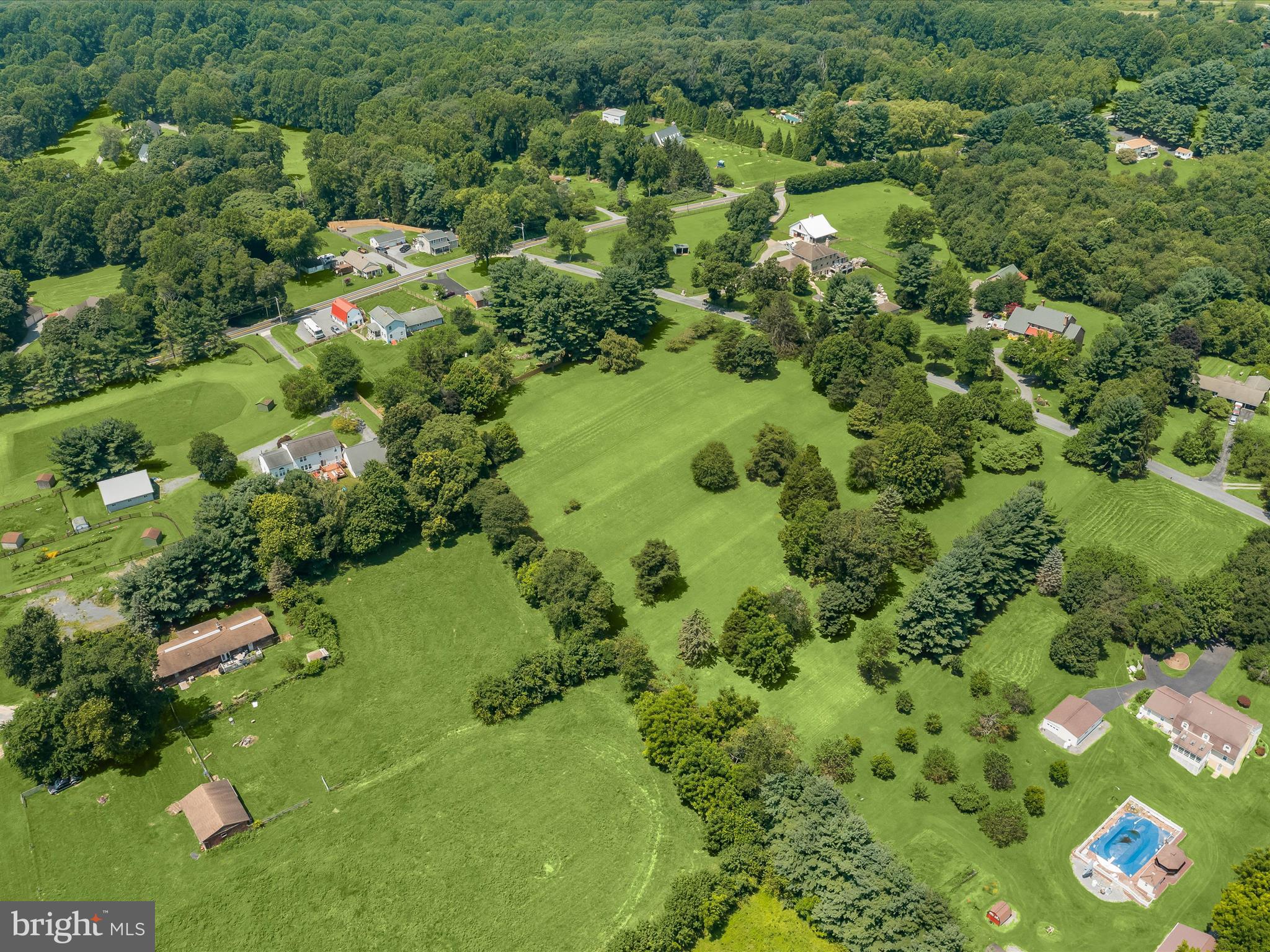 18389 New Cut Road Mount Airy, MD 21771 - Photo 25 of 41 an aerial view of residential houses with outdoor space and trees all around