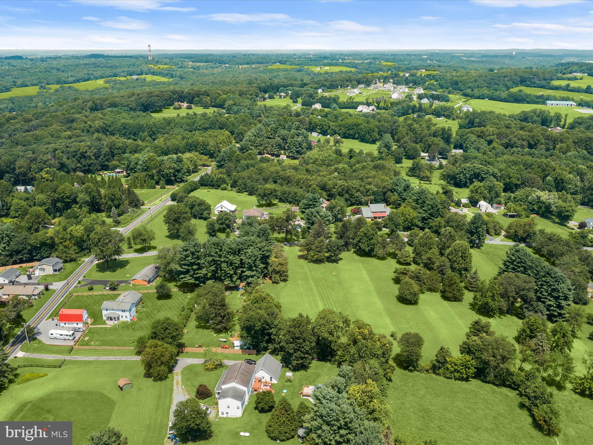 18389 New Cut Road Mount Airy, MD 21771 - Photo 27 of 41 a view of a green yard with lots of trees