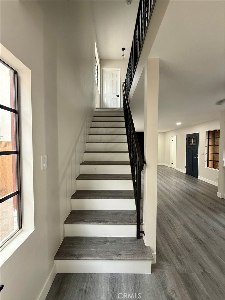 7815 Howe Street, Unit B Paramount, CA 90723 - Photo 11 of 20 a view of entryway and hall with wooden floor