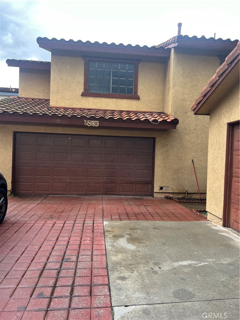 7815 Howe Street, Unit B Paramount, CA 90723 - Photo 2 of 20 a front view of a house