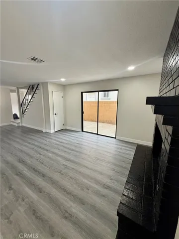 a kitchen with a sink cabinets appliances and a window