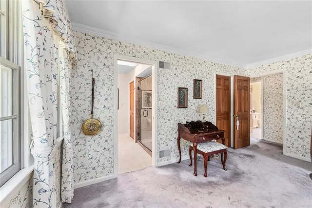 a bedroom with furniture and a window