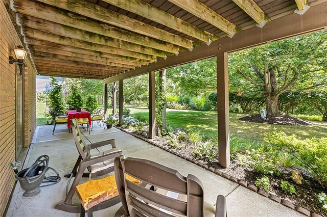 a view of swimming pool with a patio