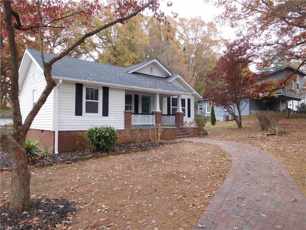 2402 Polo Road Winston-Salem, NC 27106 - Photo 2 of 30 All New: Wiring, Plumbing, 30 Year Roof & Windows. Brick sidewalk winds up to the inviting covered front porch. This home has driveway access from Polo Rd or Merrimont.