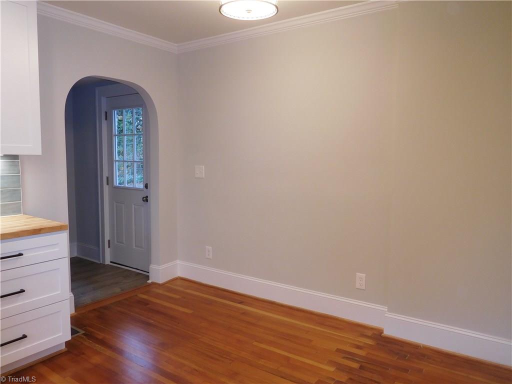 2402 Polo Road Winston-Salem, NC 27106 - Photo 16 of 30 Breakfast area. Archway leads to backdoor, mudroom area and walk-in laundry.