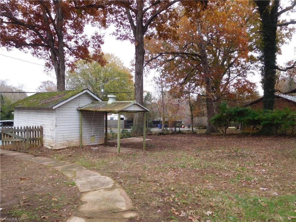 2402 Polo Road Winston-Salem, NC 27106 - Photo 29 of 30 Backyard is very spacious. This street is quiet. Large storage building - SOLD AS IS.