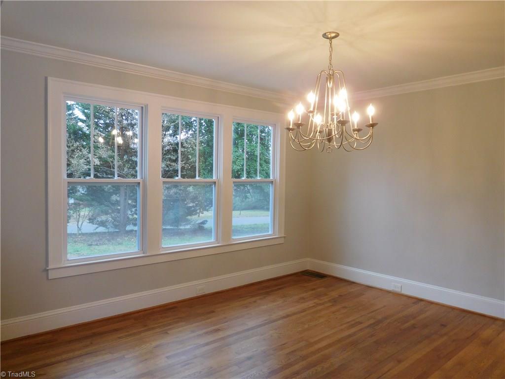 2402 Polo Road Winston-Salem, NC 27106 - Photo 7 of 30 Beautiful Dining room full of light. This home would be great for entertaining and hosting Holidays.