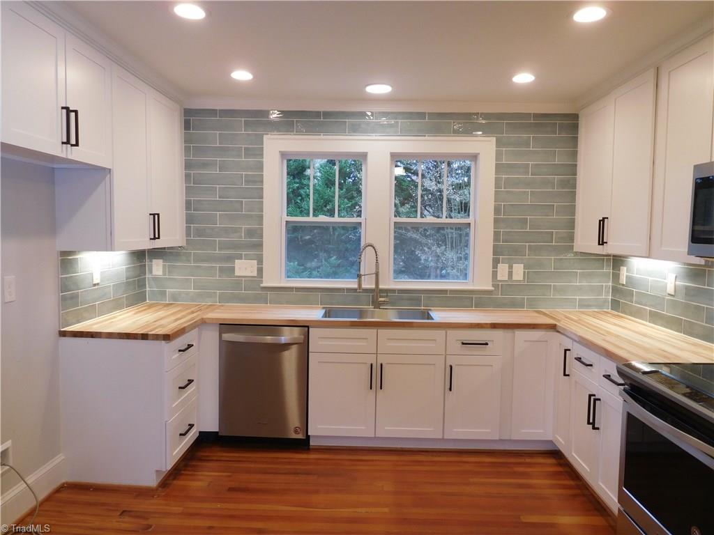 2402 Polo Road Winston-Salem, NC 27106 - Photo 10 of 30 Fantastic Kitchen! ALL NEW. Tons of lighting to make this a bright workspace.
