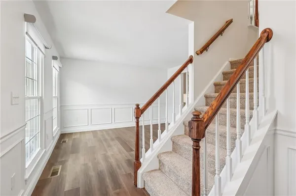 a view of entryway with wooden floor