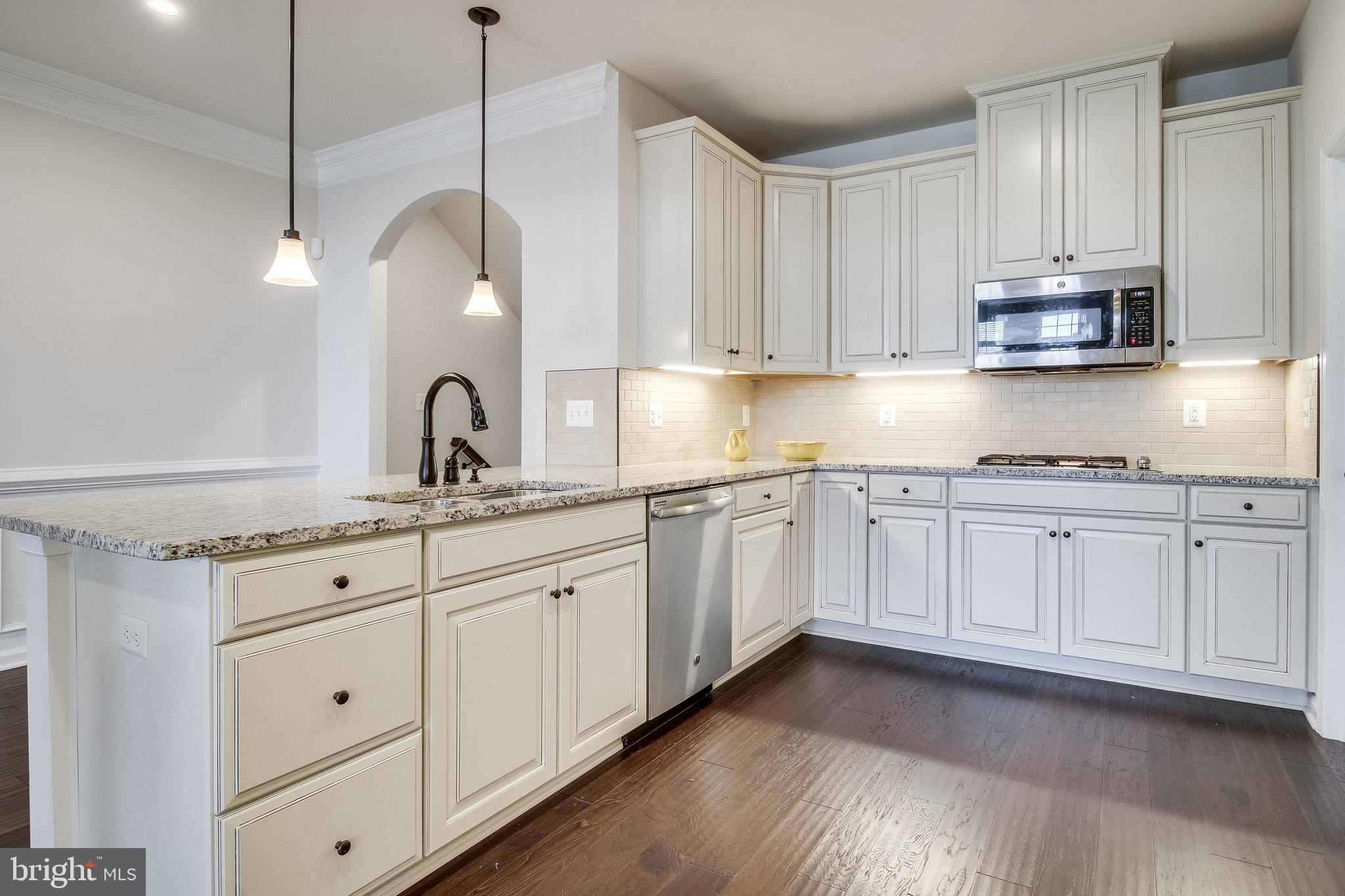 18068 Red Mulberry Road Dumfries, VA 22026 - Photo 6 of 40 Kitchen with island sink, countertop gas cooking